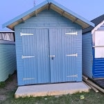 Beach hut with vent and solar panel