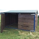 Veterinary field shelter with opening panels